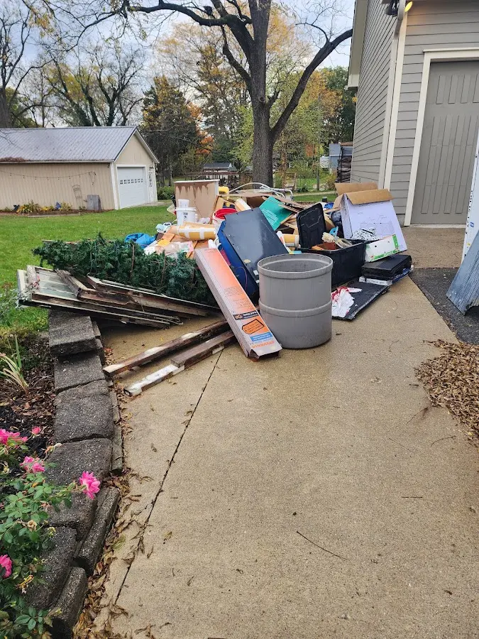 Dumpster being loaded with debris for Residential Dumpster Rental in South Greeley
